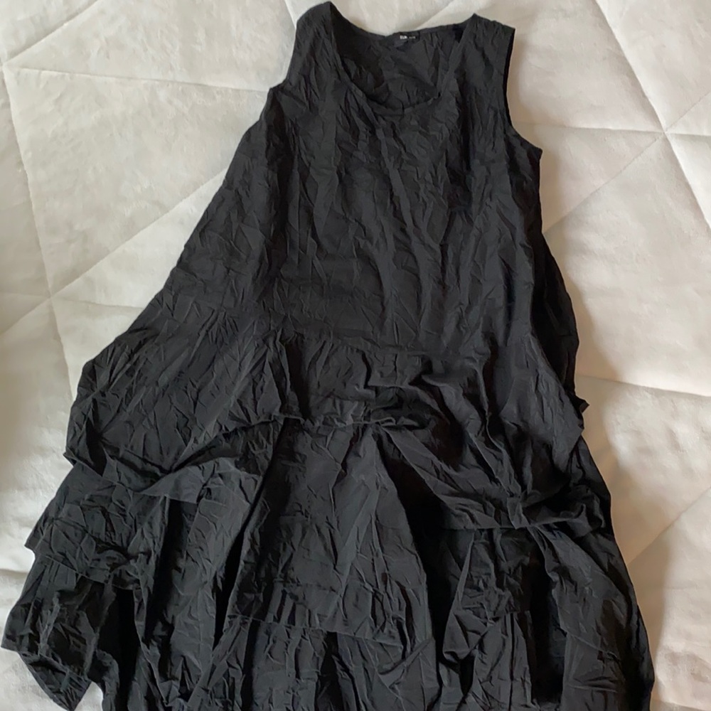 Such a fun sleeveless puffy taffeta black dress!